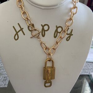 LV key lock with key 100% authentic with NWT necklace